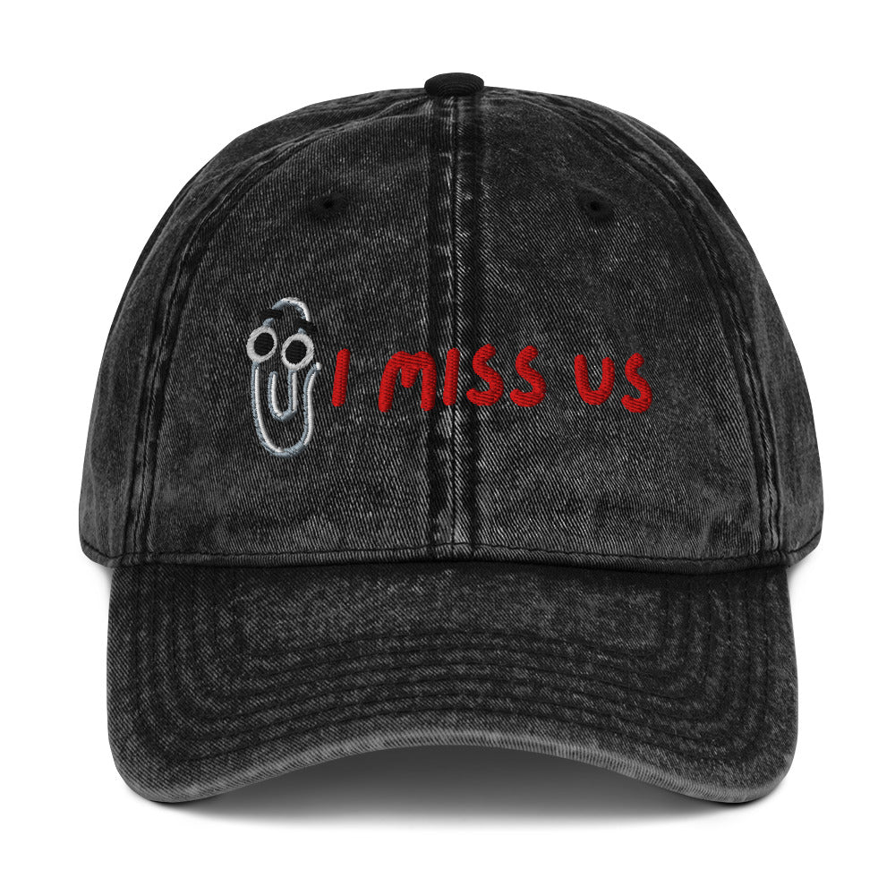 Black denim cap with 'I MISS US' text and Clippy