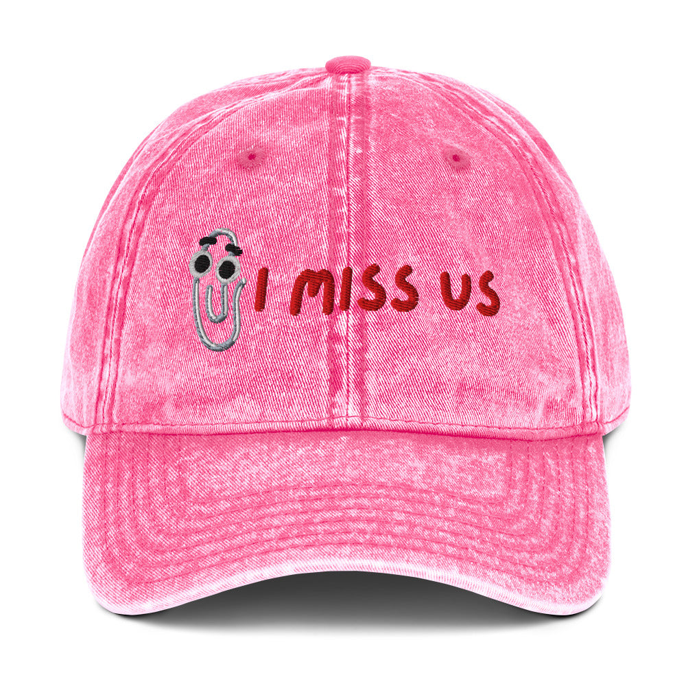 Pink cap with 'I Miss Us' text and Clippy