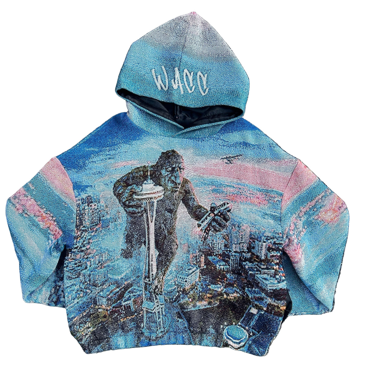 A hooded sweatshirt featuring a full-color graphic of a Fremont Troll standing on Seattle Space Needle, crushing monorail with seaplane hovering above him