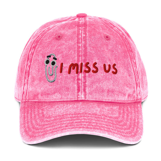 Pink cap with 'I Miss Us' text and Clippy